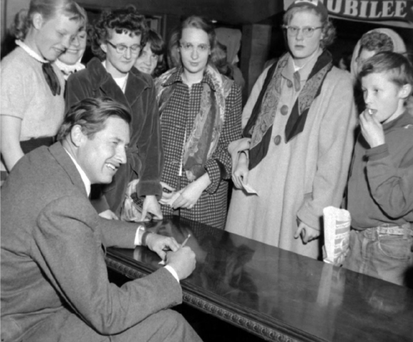 Will Rogers smiling in front of fans - 1954