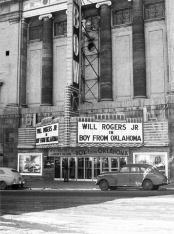 Theater front marquee advertising Will Rogers starring in Boy From Oklahoma